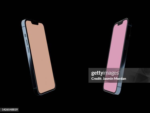 two smartphones on black background - symmetry live stock pictures, royalty-free photos & images