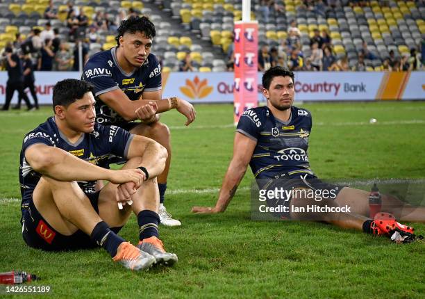 Jason Taumalolo, Murray Taulagi and Jordan McLean of the Cowboys look dejected after losing the NRL Preliminary Final match between the North...