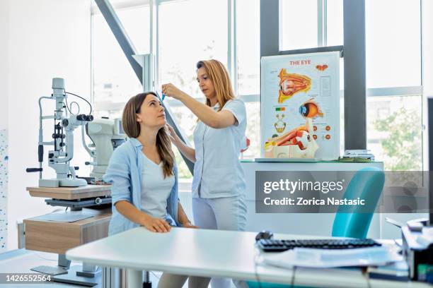 eyesight exam in clinic - ophthalmologist chart stock pictures, royalty-free photos & images