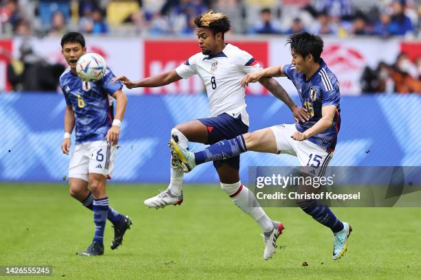 Weston McKennie of Team United States and Daichi Kamada of Team Japan battle for the ball during the International Friendly match between Japan and...