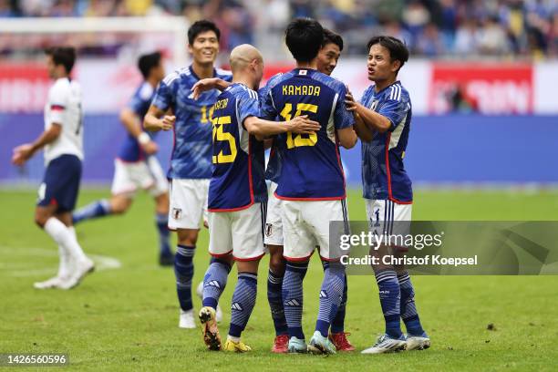 Daichi Kamada of Team Japan celebrates with teammates after scoring their team's first goal during the International Friendly match between Japan and...