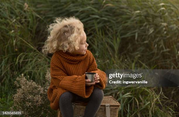 girl drinking tea at the riverside - nature photos et images de collection