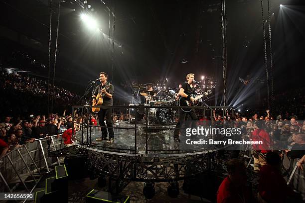 Band members of Nickelback perform at the I Wireless Center on April 10, 2012 in Moline, Illinois.