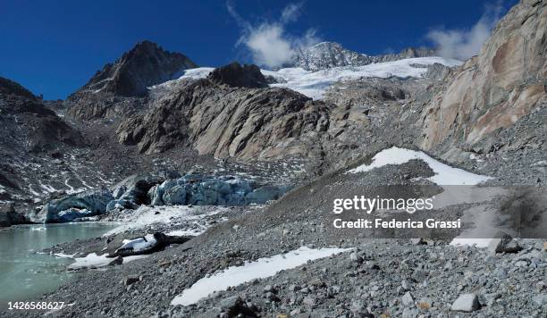 ice natural arch at the glacier mouth of tiefengletscher along the famous "nepali highway" in switzerland - moraine stock pictures, royalty-free photos & images