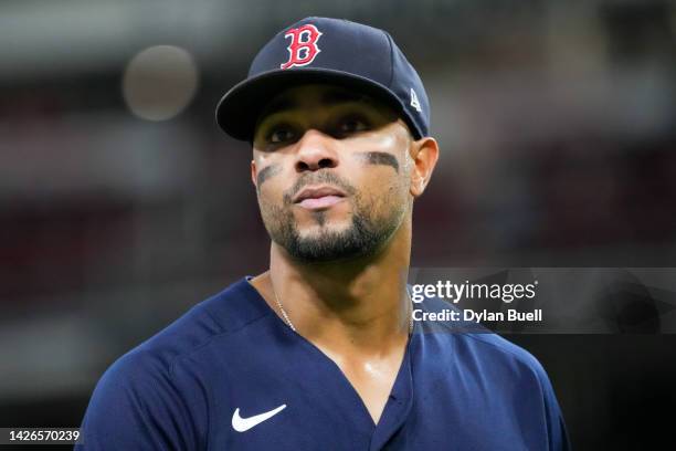 Xander Bogaerts of the Boston Red Sox walks across the field in the fifth inning against the Cincinnati Reds at Great American Ball Park on September...