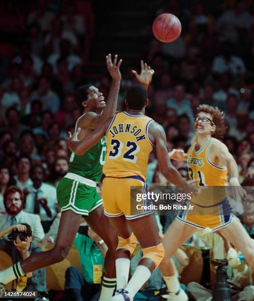 Celtics Robert Parish battles Lakers Magic Johnson and Kurt Rambis for rebound during 1985 NBA Finals between Los Angeles Lakers and Boston Celtics,...