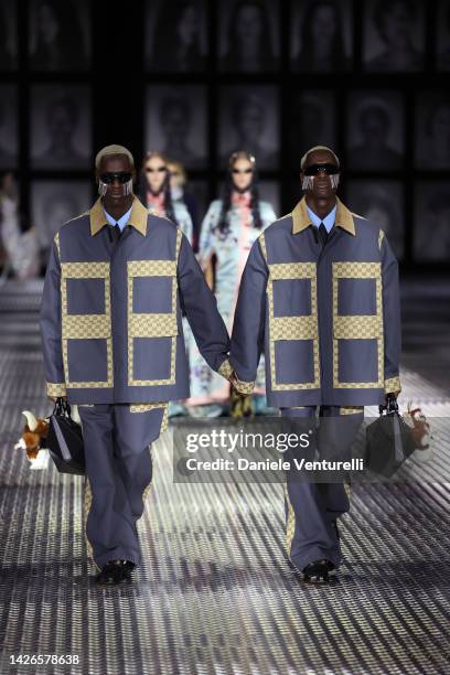 Models walk the runway of the Gucci Twinsburg Show during Milan Fashion Week Spring/Summer 2023 on September 23, 2022 in Milan, Italy.