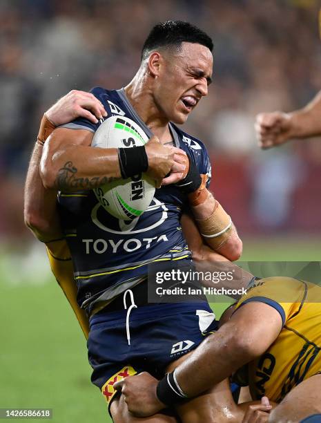 Valentine Holmes of the Cowboys is tackled by Waqa Blake and Clint Gutherson of the Eels during the NRL Preliminary Final match between the North...