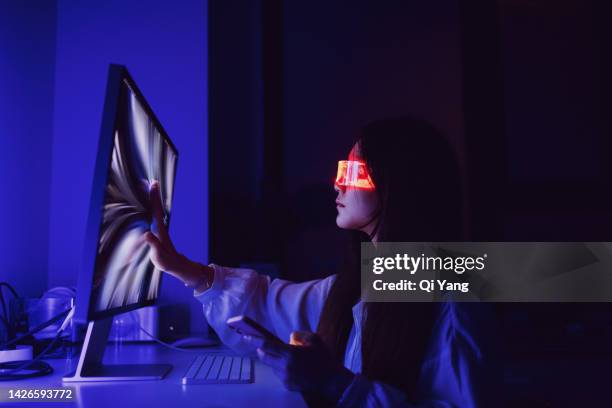 asian woman touching computer screen at home office late at night - 3d scanning stock pictures, royalty-free photos & images