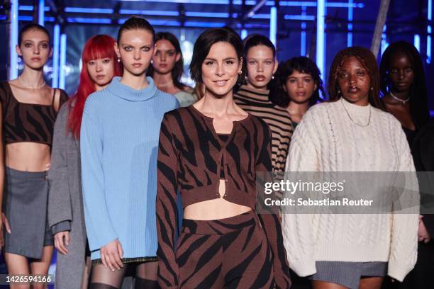 Lena Meyer-Landrut poses with models after the runway at the a lot less by Lena Meyer-Landrut show during the ABOUT YOU Fashion Week Milan 2022 at...