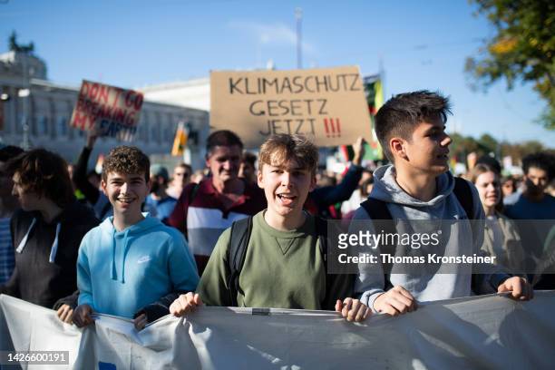 Supporters of the Fridays for Future climate action movement chant during a global climate strike on September 23, 2022 in Vienna, Austria. Similar...