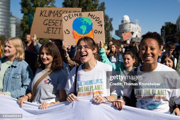 Supporters of the Fridays for Future climate action movement chant during a global climate strike on September 23, 2022 in Vienna, Austria. Similar...