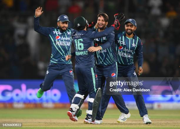 Shahnawaz Dahani of Pakistan celebrates with Mohammad Rizwan and Babar Azam after dismissing Dawid Malan of England during the 3rd IT20 between...