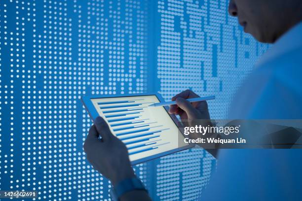 asian man using tablet - spreadsheet stock pictures, royalty-free photos & images