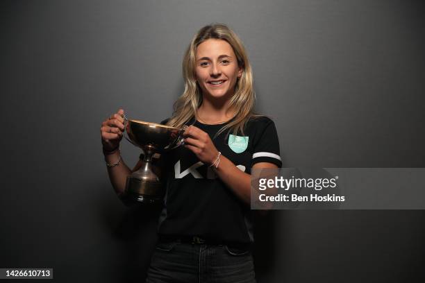 Eva Gray of Surrey poses for a picture with the trophy for the South East Stars Bowler of the Year during the Surrey County Cricket Club 2022 End of...