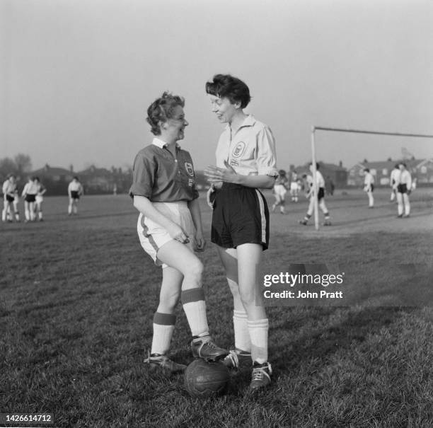 Team captains Doris Ashley and Margaret Griffiths of Nomad Ladies Football Club, at a training session in Didsbury, Manchester, April 1960. The team...