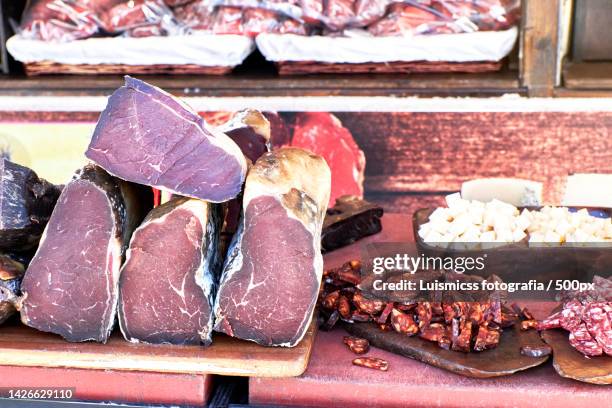 close-up of meat on table,spain - trockenfleisch stock-fotos und bilder