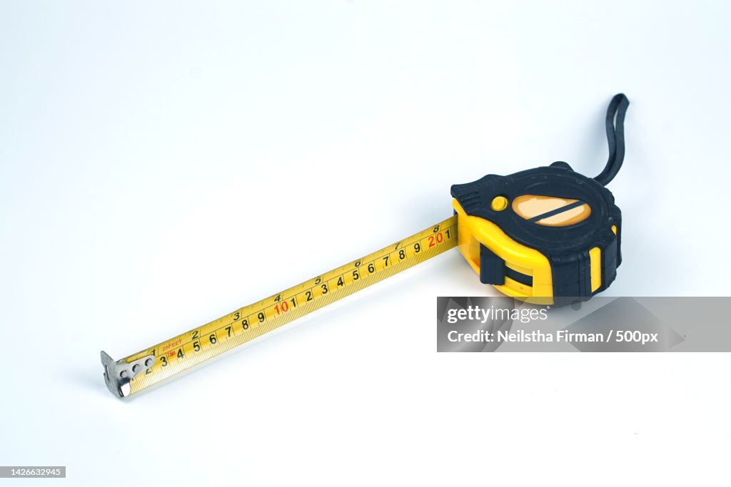 Yellow and black measuring tape with numbers,Pakal,Indonesia