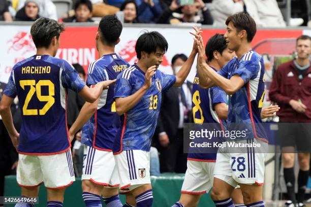 Kaoru Mitoma of Japan celebrates after scoring his team's second goal with team mate during the international friendly match between Japan and United...