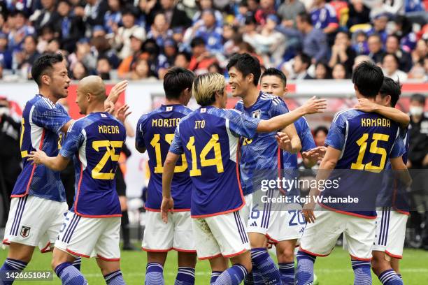 Daichi Kamada of Japan celebrates after scoring his team's first goal with teammates during the international friendly match between Japan and United...