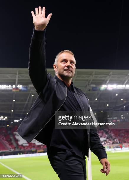 Hans-Dieter Flick, Head Coach of Germany, interacts with the crowd ahead of the UEFA Nations League League A Group 3 match between Germany and...