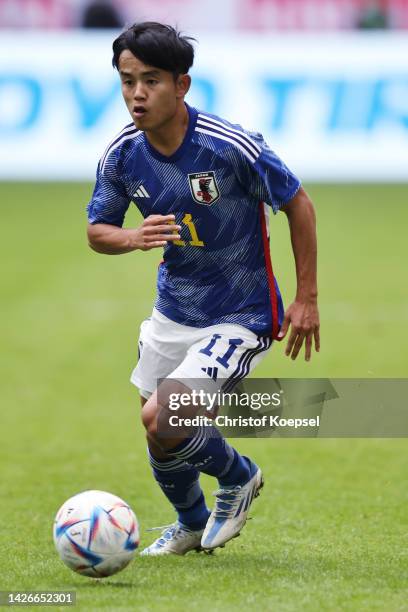 Takefusa Kubo of Japan runs with the ball during the international friendly match between Japan and United States at Merkur Spiel-Arena on September...