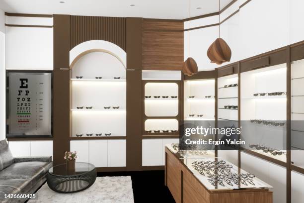brillen-vitrine und eyechart im modernen optik-shop. - augenoptiker stock-fotos und bilder