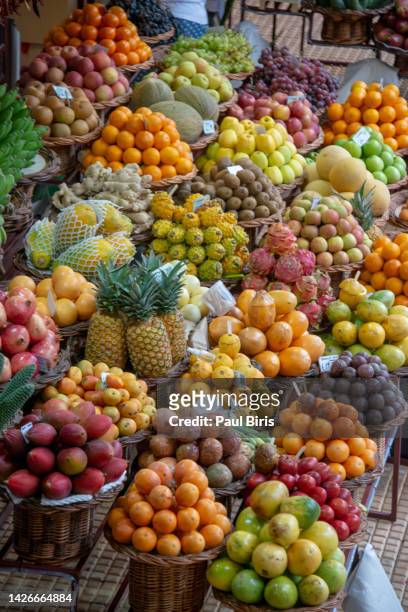fresh fruits in mercado dos lavradores funchal, madeira as background - funchal imagens e fotografias de stock