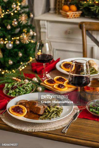 christmas dinner roast beef venison with gravy and cranberries in rustic kitchen home - roast beef dinner stock pictures, royalty-free photos & images