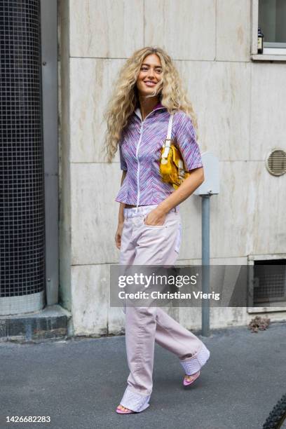 Emili Sindlev wears pink zipper jacket, Fendi bag, rose pants outside Missoni during the Milan Fashion Week - Womenswear Spring/Summer 2023 on...
