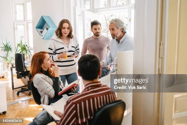 female entrepreneur delegating tasks - delegating stock pictures, royalty-free photos & images