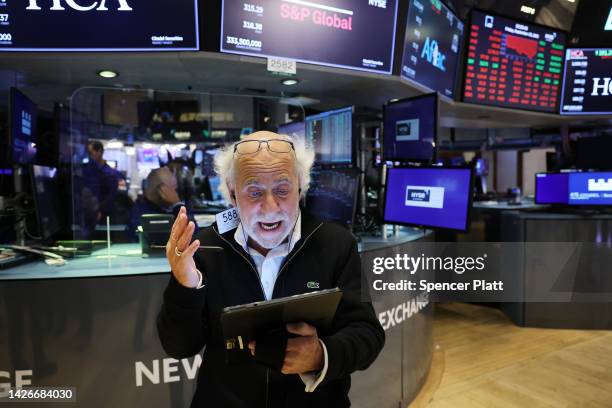 Traders work on the floor of the New York Stock Exchange on September 23, 2022 in New York City. The Dow Jones Industrial Average has dropped more...