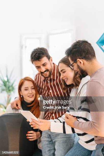 coworkers enjoying their working as a team - new colleague stock pictures, royalty-free photos & images