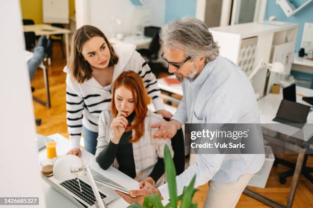 team leader delegating tasks to his team - delegating stock pictures, royalty-free photos & images