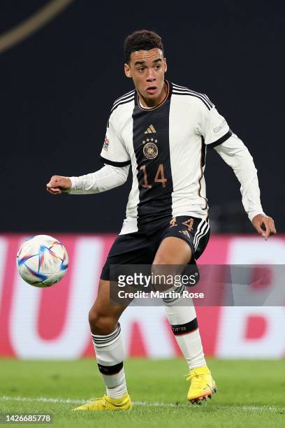 Jamal Musiala of Germany dribbles with the ball during the UEFA Nations League League A Group 3 match between Germany and Hungary at Red Bull Arena...