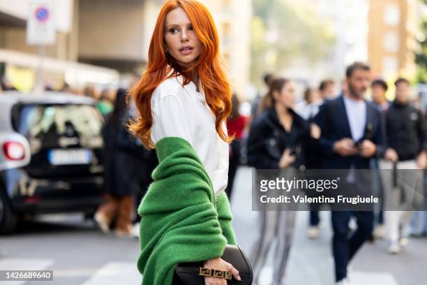 Evelyn Kazantzoglou is seen wearing Misson printed pants, a white blouse and a green coat at Missoni show during the Milan Fashion Week - Womenswear...