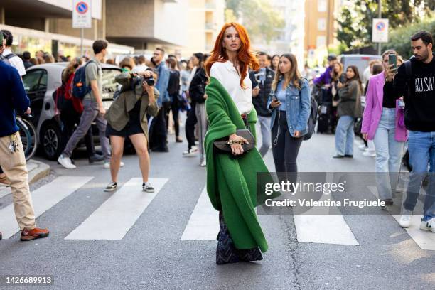 Evelyn Kazantzoglou is seen wearing Misson printed pants, a white blouse and a green coat at Missoni show during the Milan Fashion Week - Womenswear...