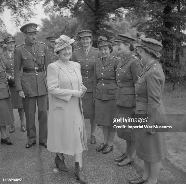 Queen Elizabeth meets Auxiliary Territorial Service officers including Subaltern Mary Churchill, the Prime Minister's daughter Hyde Park, London,...