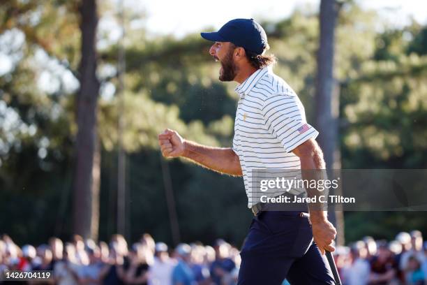 Max Homa of the United States Team celebrates making his putt on the 18th hole to win the match 1 Up over Corey Conners of Canada and Taylor Pendrith...