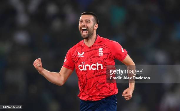 Mark Wood of England celebrates taking the wicket of Babar Azam of Pakistan during the 3rd IT20 match between Pakistan and England at Karachi...