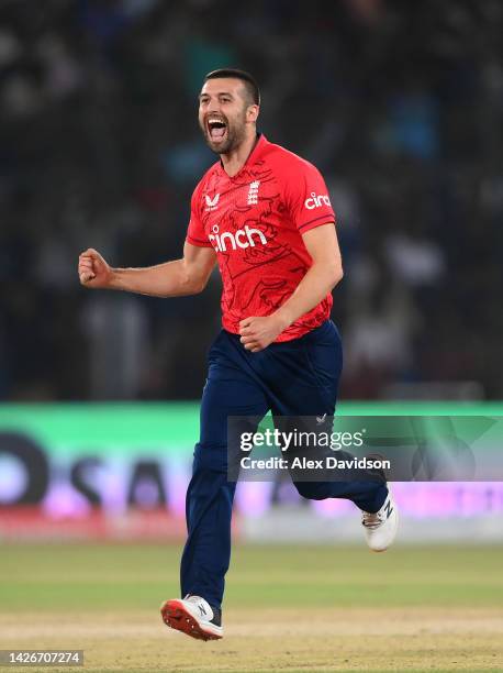 Mark Wood of England celebrates taking the wicket of Babar Azam of Pakistan during the 3rd IT20 match between Pakistan and England at Karachi...