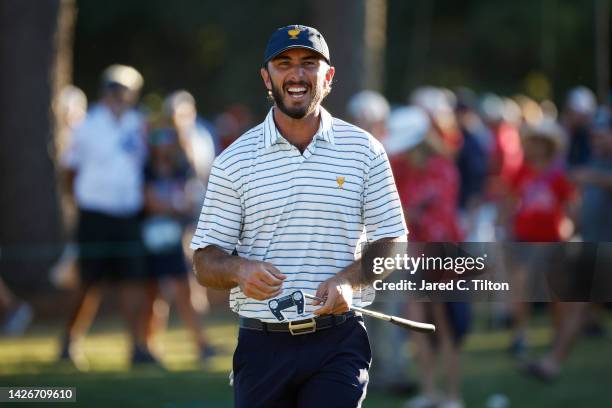 Max Homa of the United States Team celebrates after making his putt on the 18th green to win with teammate Billy Horschel 1 Up against Corey Conners...