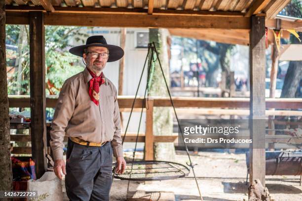 portrait of a gaucho at the farroupilha camp - olhar para a câmera stock pictures, royalty-free photos & images