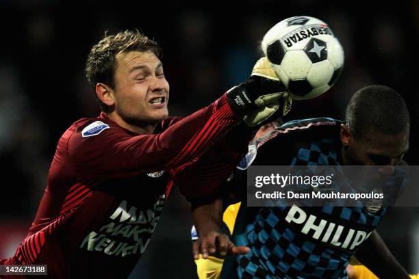Goalkeeper, Jeroen Zoet of RKC punches the ball away from Orlando Engelaar of PSV during the Eredivisie match between RKC Waalwijk and PSV Eindhoven...