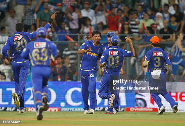 Rajasthan Royals bowler Siddarth Trivedi celebrates with his teammates after dismissal of Mumbai Indian batsman Tirumalasetti Suman during the IPL...