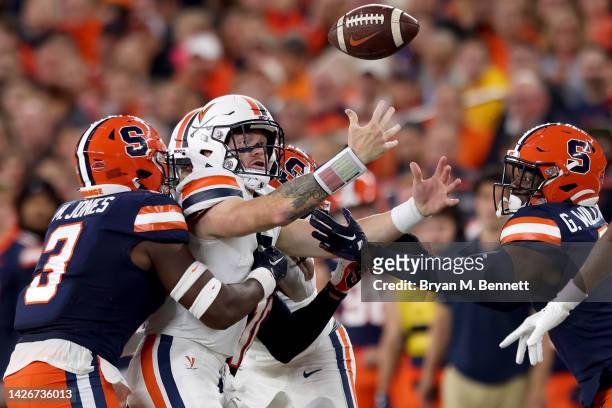 Mikel Jones tackles Bennan Armstrong of the Virginia Cavaliers as he loses the ball during the first quarter at JMA Wireless Dome on September 23,...