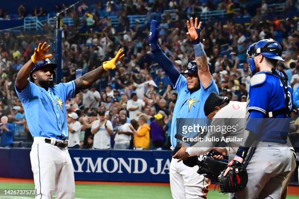 Randy Arozarena of the Tampa Bay Rays celebrates with Harold Ramirez after hitting a three-run home run in the fifth inning against the Toronto Blue...