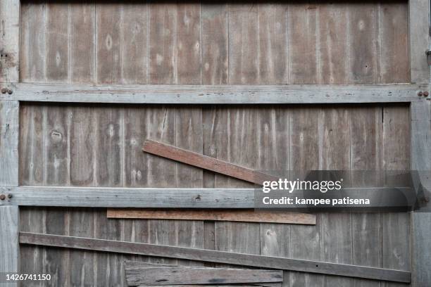 old wooden barn door. wooden wall. - wooden shed stock pictures, royalty-free photos & images