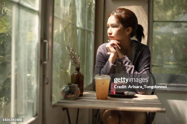 a young girl is waiting for someone's arrival. - second chance stock pictures, royalty-free photos & images