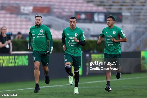 Hector Herrera, Rogelio Funes Mori and Luis Romo of Mexico warm up during a training session ahead of a match between Mexico and Peru at Rose Bowl...